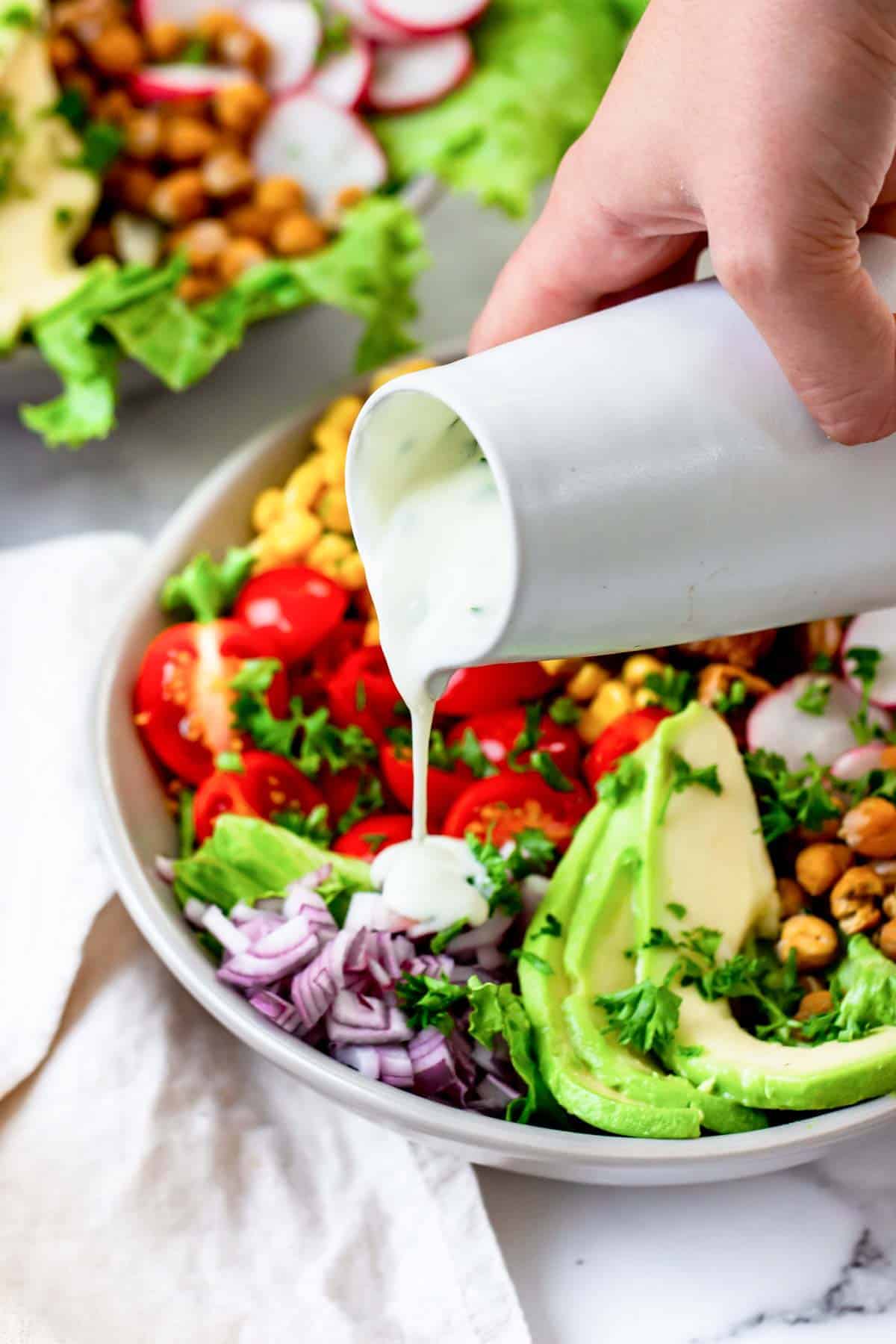 vegan cobb salad drizzled with vegan ranch