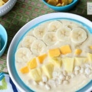 Tropical Smoothie Bowl - Sometimes you just don't feel like drinking your meals. Put together this bowl full of healthy sunshine for your next breakfast! | www.happyfoodhealthylife.com
