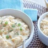 Healthy Herb & Garlic Mashed Cauliflower - A healthy alternative to mashed potatoes that will please everyone! Full of flavor. Healthy. And no one will even know the difference. Really!