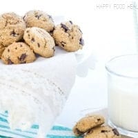 everything free cookies on a pedestal with a glass of milk. 