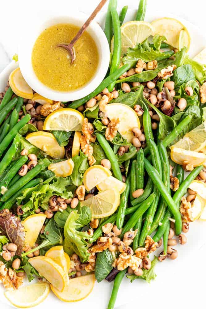 Green Bean Salad with a bowl of dressing.