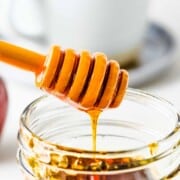vegan honey dripping into a jar.