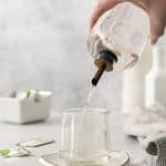 stevia syrup pouring into a glass.