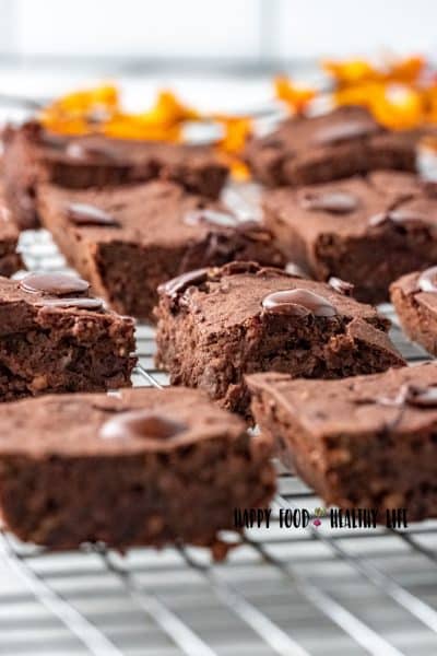 Photo of black bean brownies, fully cooled on a baking rack, and ready to enjoy.