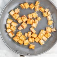 Top view photo of a saucepan with tofu in the saucepan.