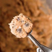 Close-up photo of a scoop of vegan peanut butter cookies dough, ready to bake.